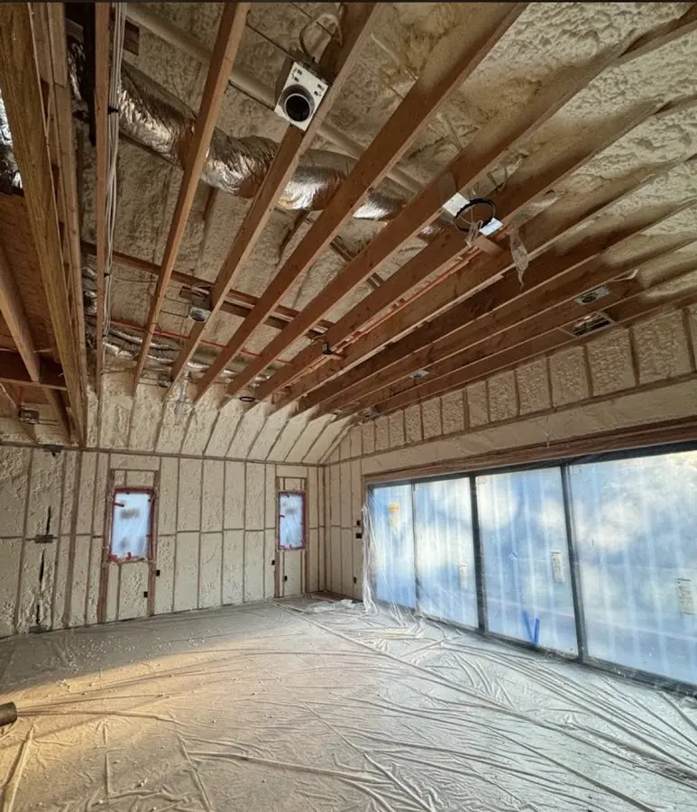 Interior walls and ceiling insulated with spray foam during new construction in Cheshire